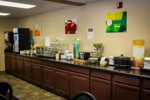 a long counter with pots and pans on it at Quality Inn Colorado Springs Airport in Colorado Springs