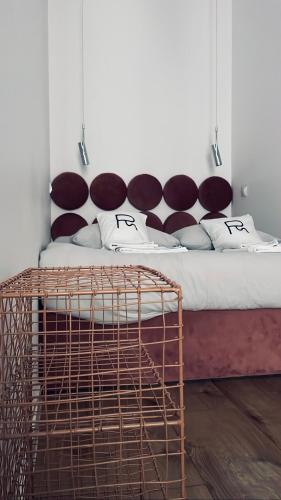 a room with a bed with a rattanradeokedoked at Rost Apartments in Bielsko-Biała
