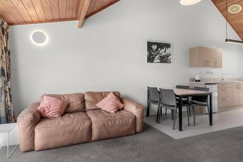 a living room with a couch and a table at Bethshan Motel in Algies Bay