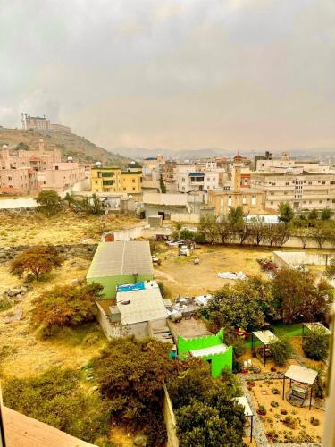 a view of a city with buildings in the background at قمم النماص 2 Qimam alnamas in Al Namas