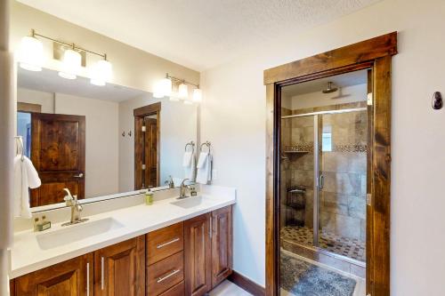 a bathroom with two sinks and a shower at Park City Retreat in Kamas