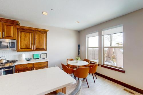 a kitchen with a table and chairs and a window at Park City Retreat in Kamas