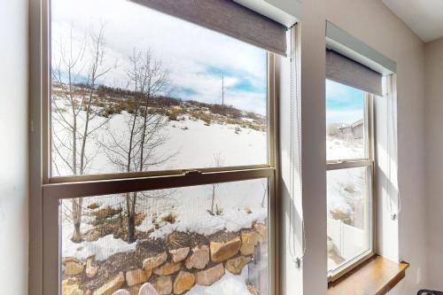 a window with a view of a snowy mountain at Park City Retreat in Kamas