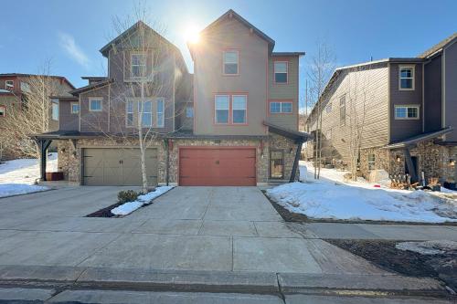 a house with a red garage in the driveway at Park City Retreat in Kamas