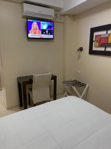 Μια τηλεόραση ή/και κέντρο ψυχαγωγίας στο Apart Hotel Ayres De Termas
