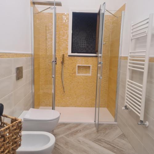 a bathroom with a shower and a toilet and a sink at Tenuta Rispoli Pogerola in Amalfi