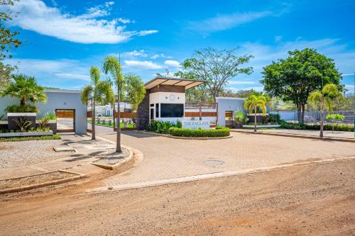 a house with a road in front of it at The Enclave D9 in Playa Avellana