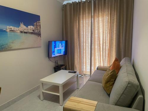 Телевизор и/или развлекательный центр в City Center Apartments