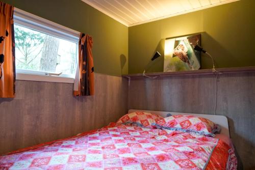 Postel nebo postele na pokoji v ubytování Chalet Hoenderloo Beuk