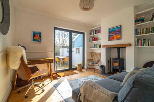 a living room with a desk and a couch at Stylish Home with 4 bedrooms, Logburner, Garden, nr Beach, Deal Castle in Deal