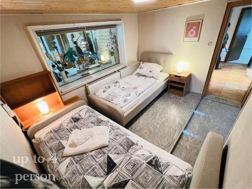 Katil atau katil-katil dalam bilik di Ferienhaus am Elberadweg mit Sauna & Kamin - Natur, Erholung & S-Bahn-Anbindung - Saxon Oase