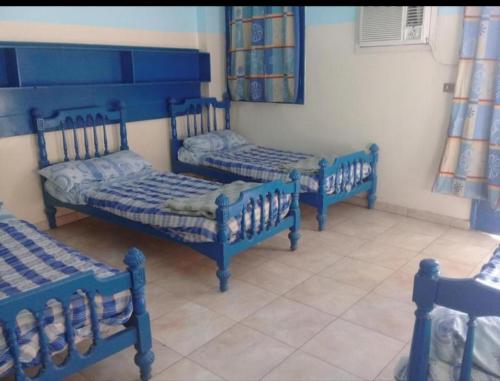 Postel nebo postele na pokoji v ubytování Oasis hotel