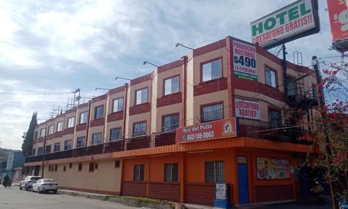a building with a hotel on the side of a street at Hotel Tapatio in Tijuana