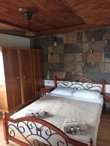 a bedroom with a bed with two baskets on it at Zagora MGHouse in Zagora