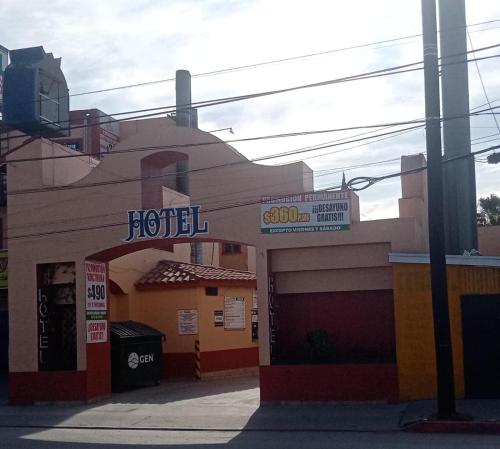 a hotel with a sign on the front of it at Hotel Tapatio in Tijuana