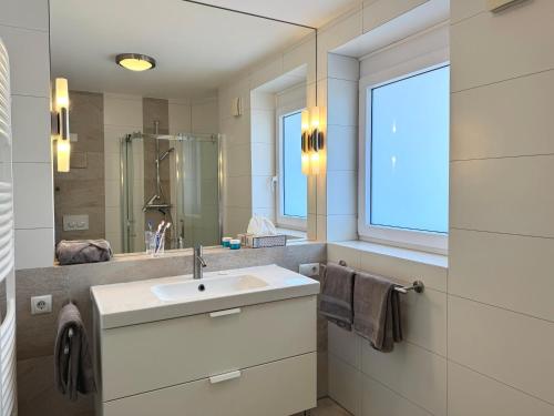Ένα μπάνιο στο Ferienwohnung de Roggenbloom