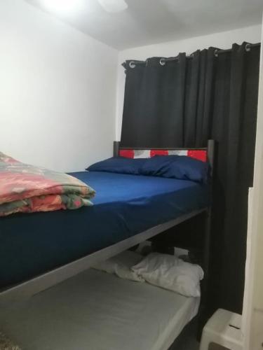 a bedroom with two bunk beds with blue sheets at A 5 minutos GNP Hostal Foro Sol Palacio Deportes Aeropuerto A PET FRIENDLY se aceptan mascotas bajo peticion in Mexico City