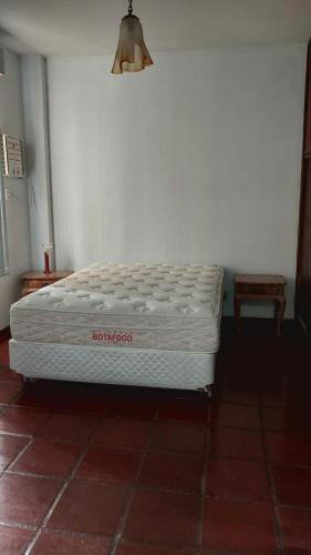 a mattress sitting on the floor in a room at Apartamento na praia do forte in Cabo Frio