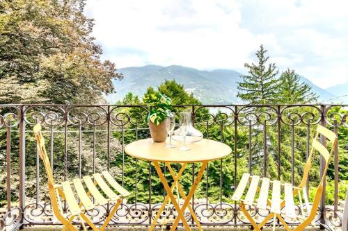 a table and two chairs on a balcony at Blue Como Luxury APT #2 in Como