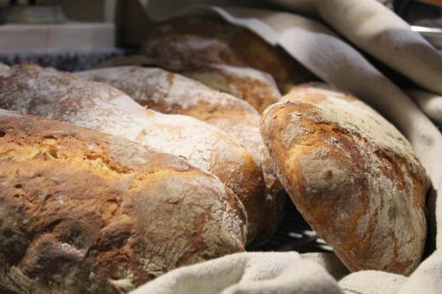 a group of loaves of bread in a basket at Hotel Ristorante Benigni in Campagnano di Roma