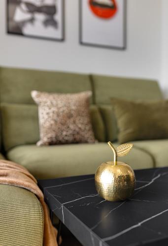 a gold pumpkin sitting on a black table in a living room at Benidorm Beach Belluba luxury bay in Benidorm