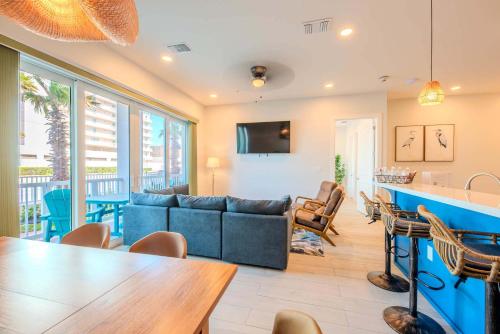 a living room with a couch and a table at Starfish Shores in South Padre Island