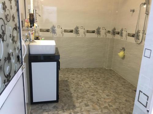 a bathroom with a sink and a shower at Galle MK Villa in Galle