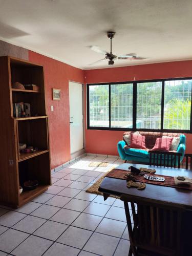 a living room with a couch and a table at Departamento Amanecer in Yalsí