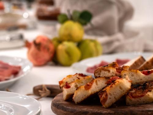 a plate of food on a table with food at Masseria Del Crocifisso in Polignano a Mare