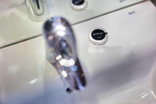 a close up of a bathroom sink with a faucet at Clifton House Brighton in Portslade