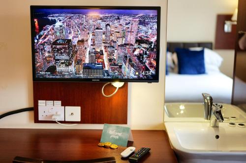 a computer monitor sitting on top of a desk at Clifton House Brighton in Portslade