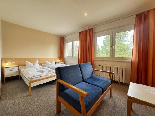 Postel nebo postele na pokoji v ubytování Hotel am Lärchenberg I Frühstück, WLAN, Parkplatz