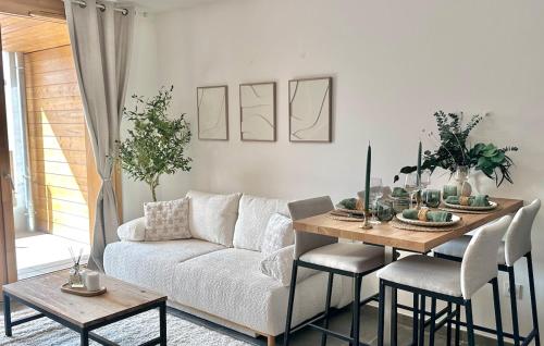 a living room with a couch and a table at Le MAMCosy - Porte de Genève - Annemasse Pied Gare - Hyper Centre - New Eco-quartier in Annemasse