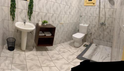 a bathroom with a sink and a toilet at Dahab Lodge in Dahab