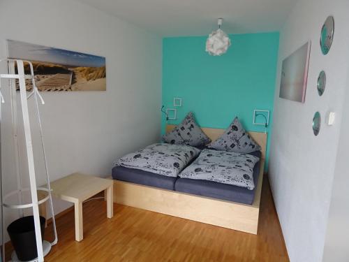 a small bedroom with a bed and a ladder at Apartment Schultheiss in Konstanz