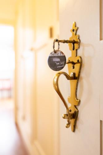 a key chain is attached to a wall at Casa da Ria - Turismo Rural in Ílhavo