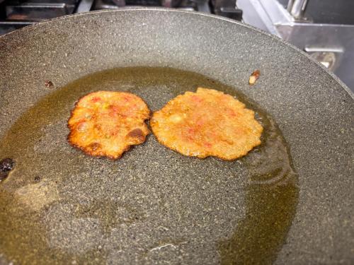 two pancakes cooking in a pan on a stove at APA Hotel Nagano in Nagano