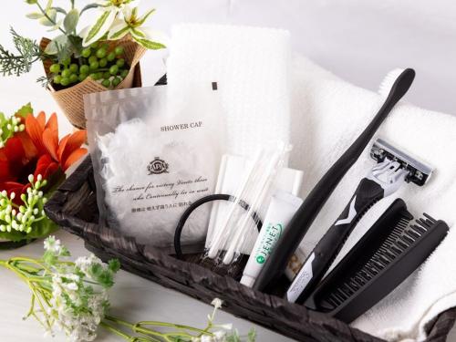 a tray with a comb and other items on a table at APA Hotel Nagano in Nagano