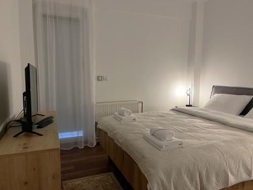 Ein Bett oder Betten in einem Zimmer der Unterkunft Liberte Apartments Voždovac