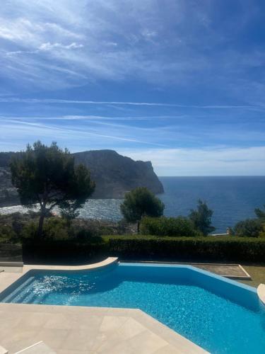 a swimming pool with a view of the ocean at Villa with amazing sea views in Port d’Andratx