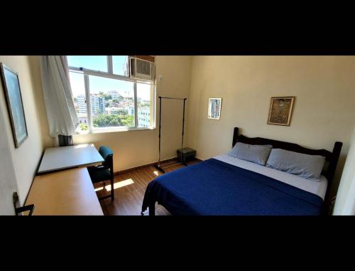 Postel nebo postele na pokoji v ubytování Meu espaço no Catete