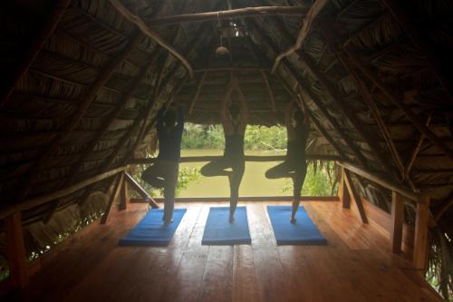a view from the inside of a room with yoga mats at El Hotelito Perdido in Río Dulce