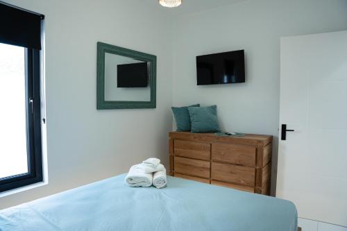 Una cama o camas en una habitación de 2 BDR - Mangel Residence Aruba - NEW