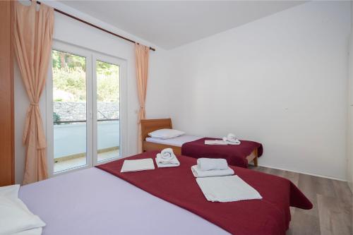 Ένα ή περισσότερα κρεβάτια σε δωμάτιο στο Apartment Karlo