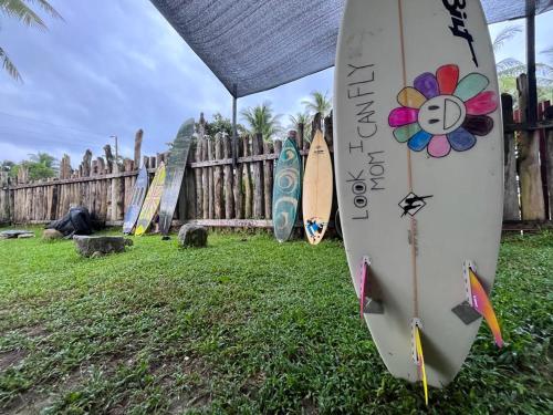 a group of surfboards lined up against a fence at Tabularasa - T Palawan in San Vicente