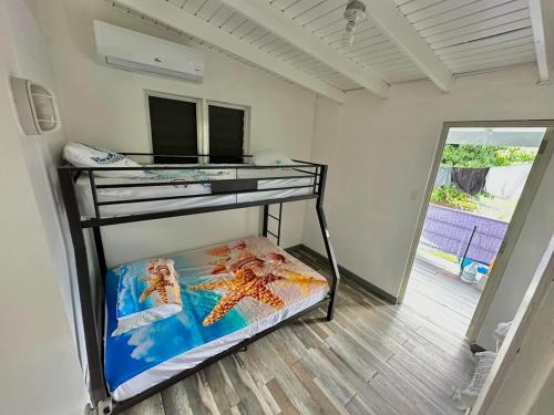 a bedroom with a bunk bed with a starfish on it at Sea Breeze Paradise in Cabo Rojo