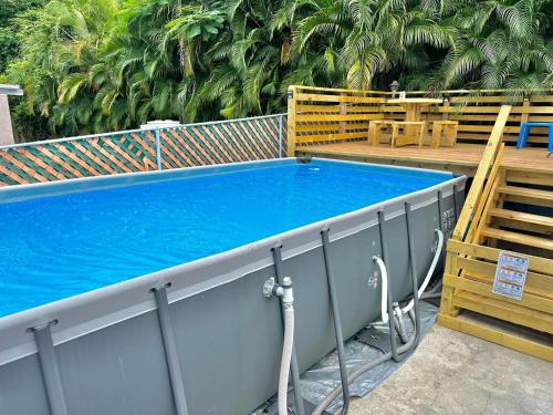a large blue swimming pool on top of a building at Sea Breeze Paradise in Cabo Rojo