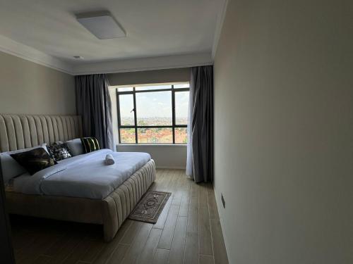 Postel nebo postele na pokoji v ubytování Ultra Luxury 2 bedroom Apartment in the Heart of Lavington