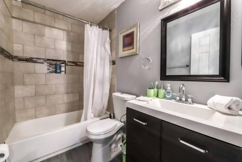 a bathroom with a sink and a toilet and a bath tub at What you need A Hidden Gem in the Heart of Vegas in Las Vegas