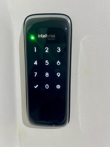 a smart phone is attached to a wall at Lapa Loft, estúdio vintage com total infraestrutura na Lapa, RJ in Rio de Janeiro